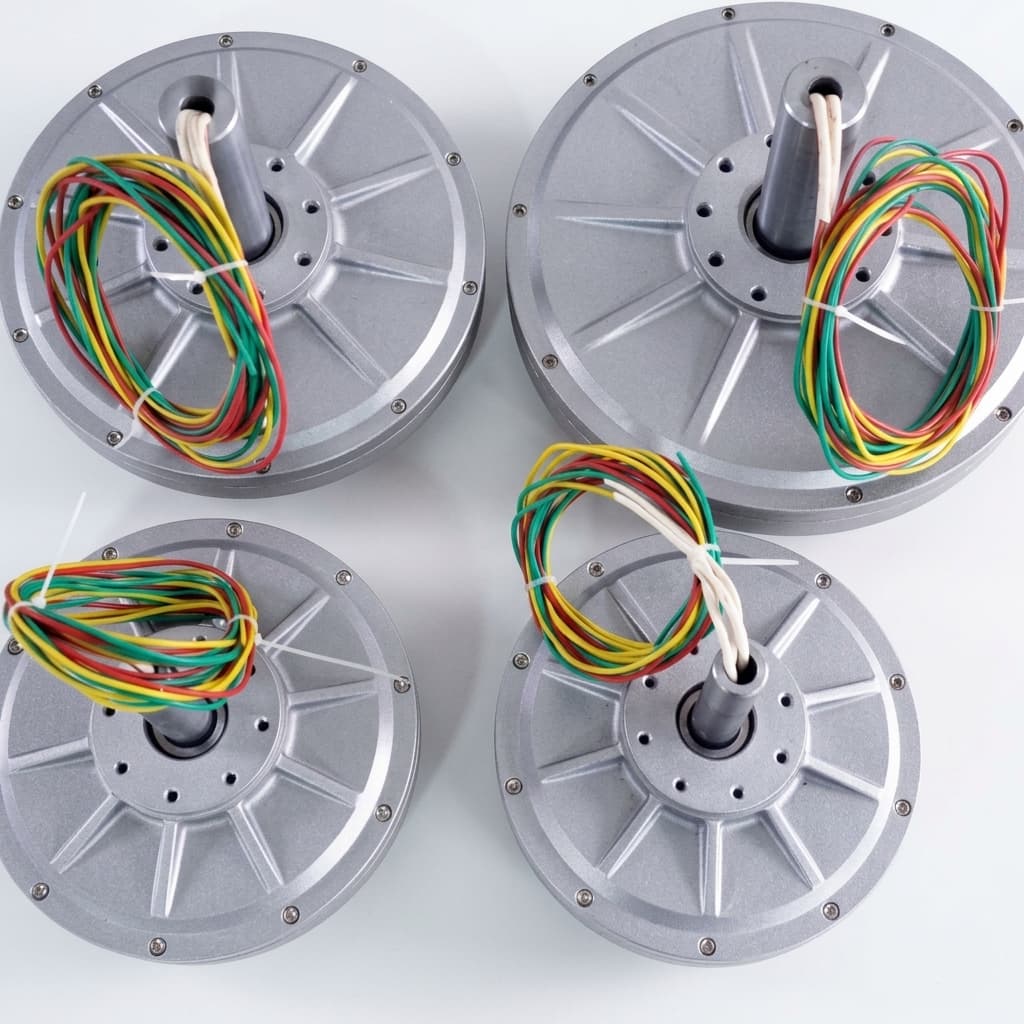Compact axial flux alternator package with flat round housing and multi-phase output leads